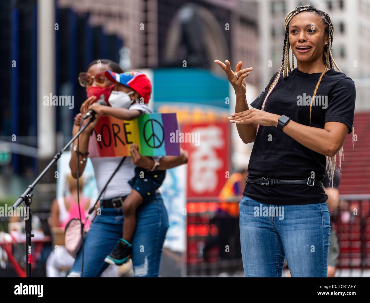 New York, New York, USA. 15th Aug, 2020. New York, New York, U.S.: a Sign Language Interpreter shares SHIRLEY BROWN's story during a Black Youth March at Times Square. Credit: Corine Sciboz/ZUMA Wire/Alamy Live News Stock Photo