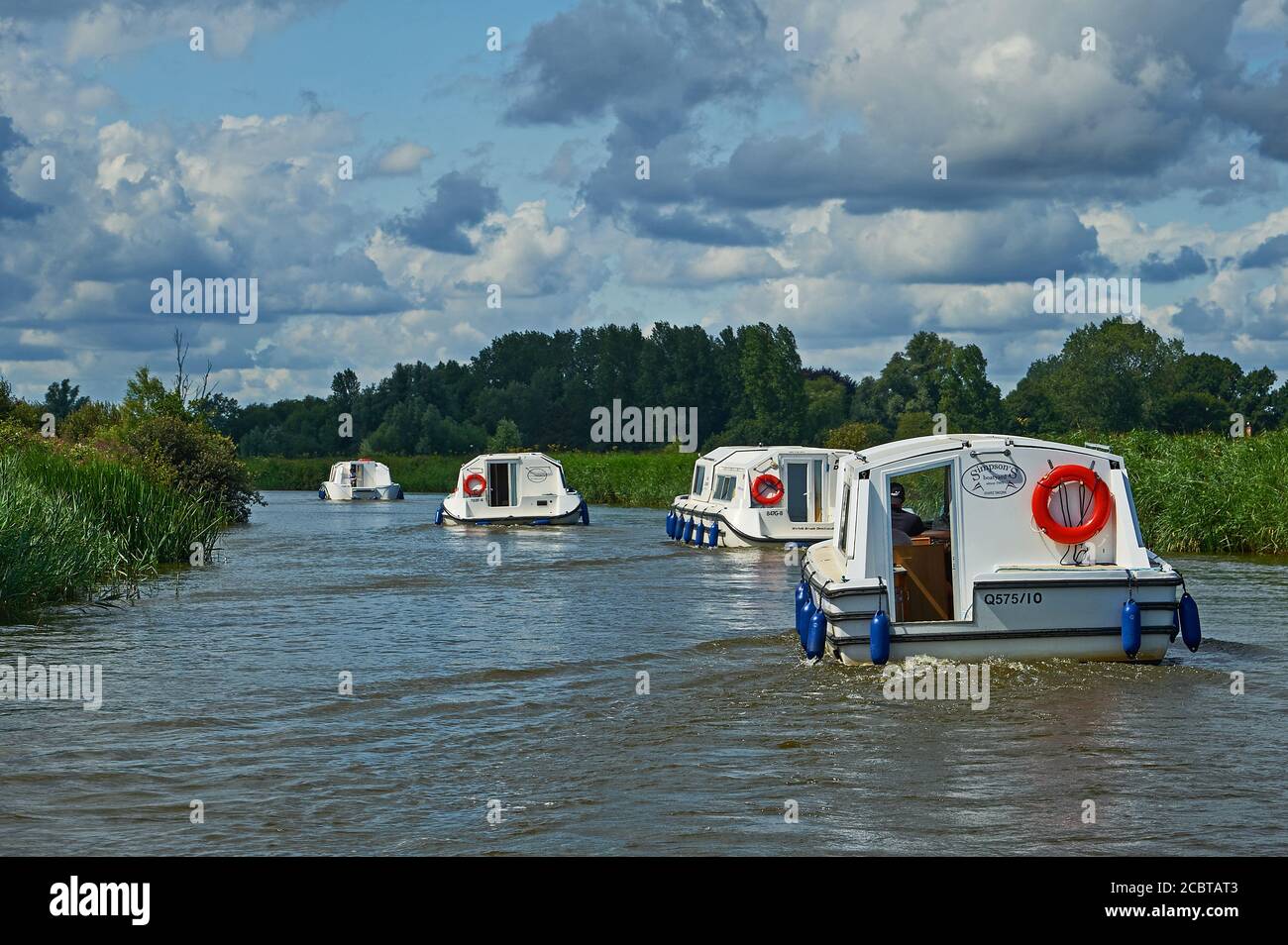 Motor cruisers on the River Ant, Norfolk Broads National Park, Norfolk Stock Photo