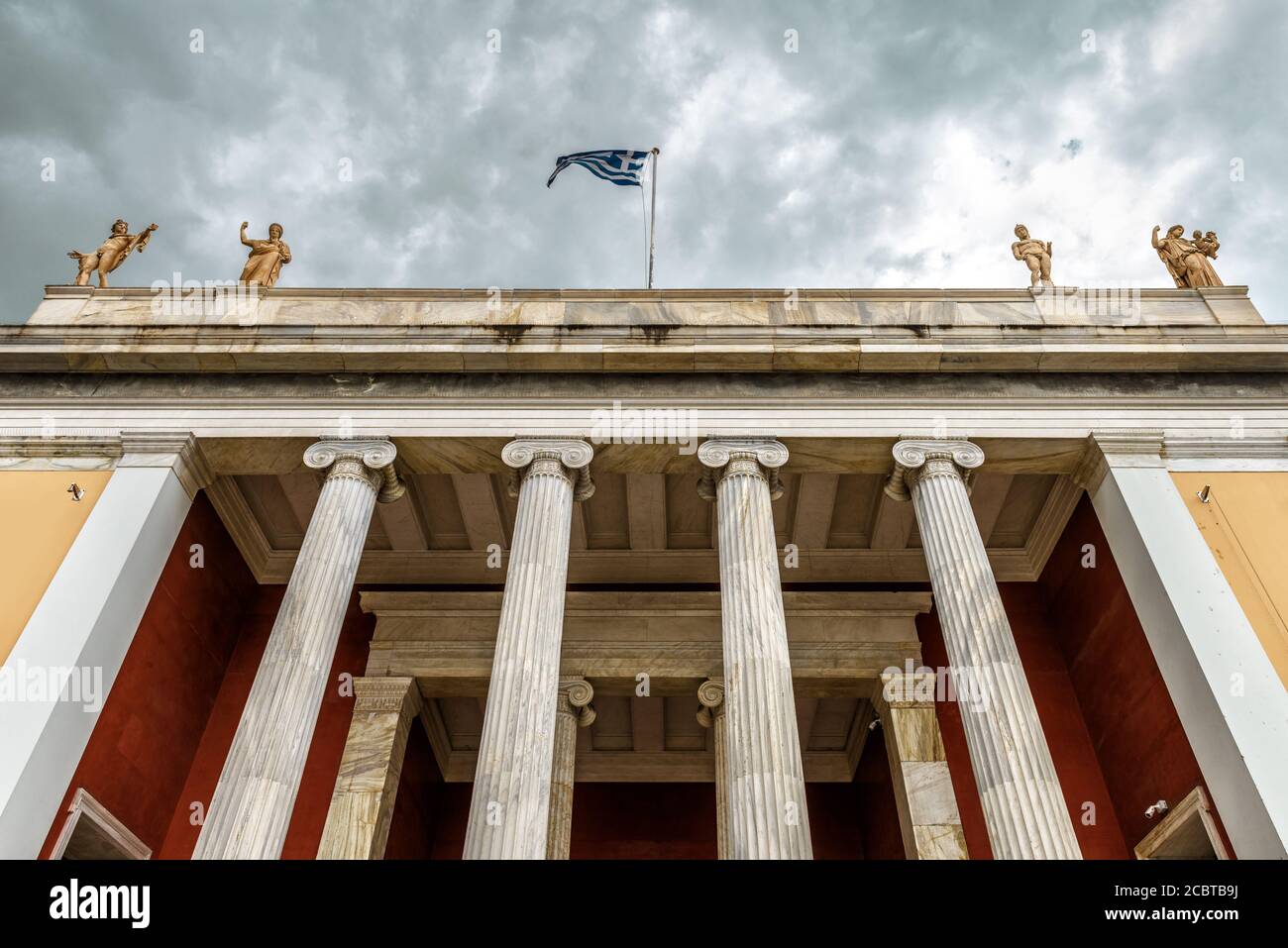 National Archaeological Museum of Athens, Greece. It is one of main historical landmarks of Athens. Bottom view of museum entrance under dramatic sky. Stock Photo