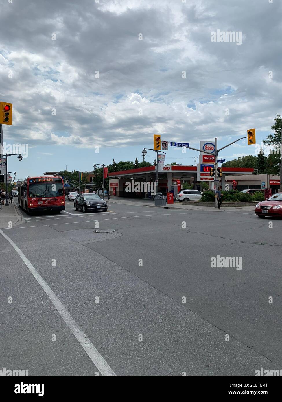 Esso gas station and traffic at intersection of Gladstone and Bank streets. Ottawa, Ontario / Canada. Stock Photo