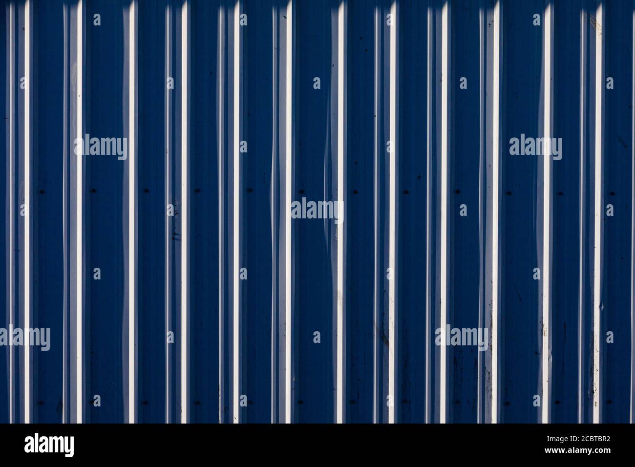 Abstract image of blue ribbed metal cladding on a building in Steveston British Columbia Canada Stock Photo