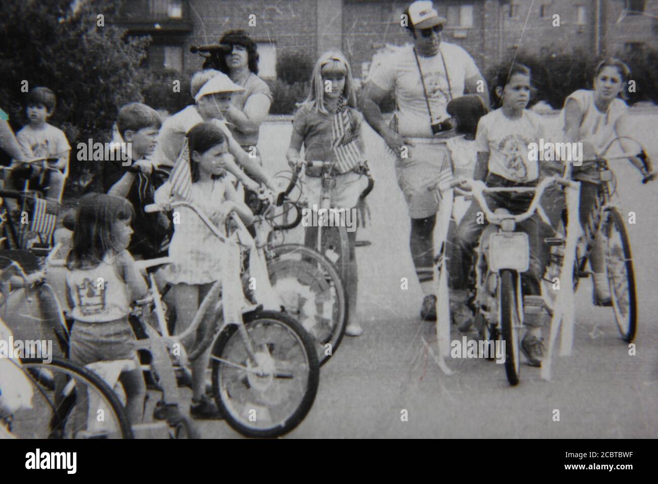 Fine 1970s vintage black and white photography of kids on bikes at the  local neighborhood street fair Stock Photo - Alamy