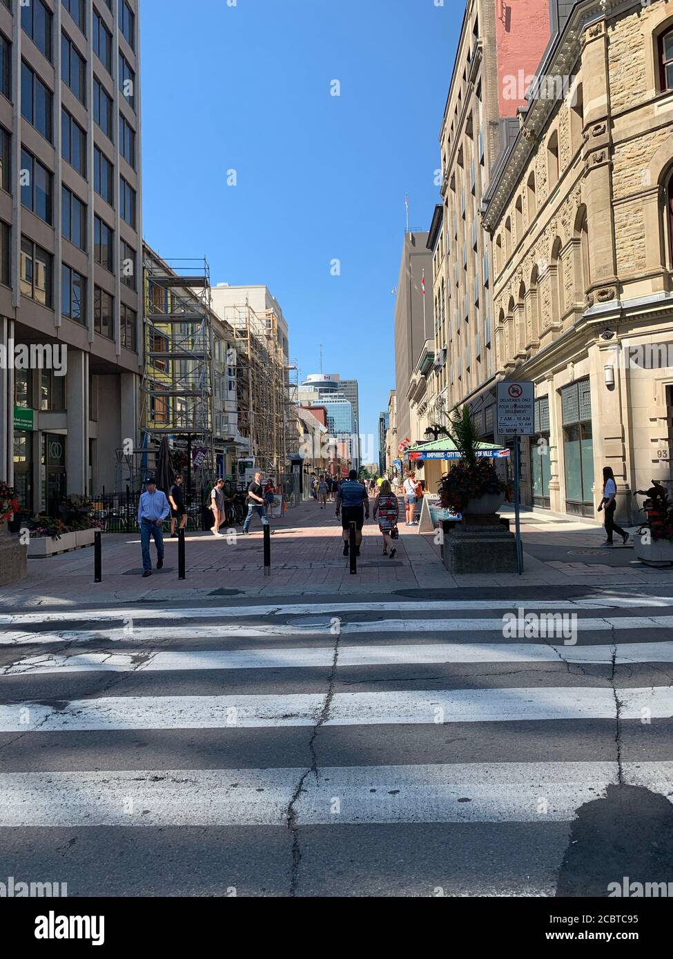 Pedestrian Sparks street during summer time at Canadian capital. Pedestrian crossing with cracks. Ottawa, Ontario / Canada Stock Photo