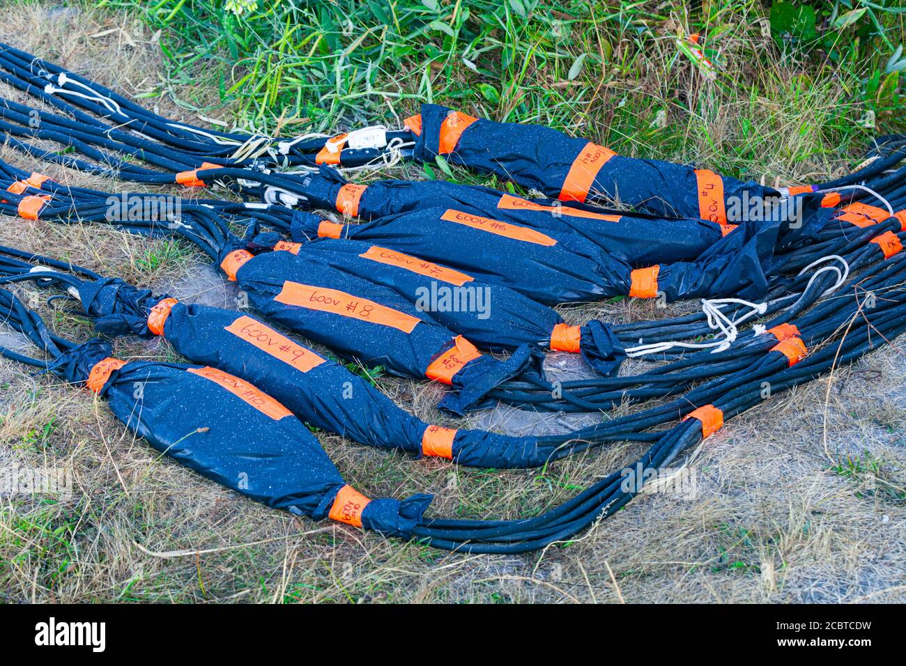 Flexible power cables laid out for an on location movie shoot for Netflix in Steveston British Columbia Canada Stock Photo