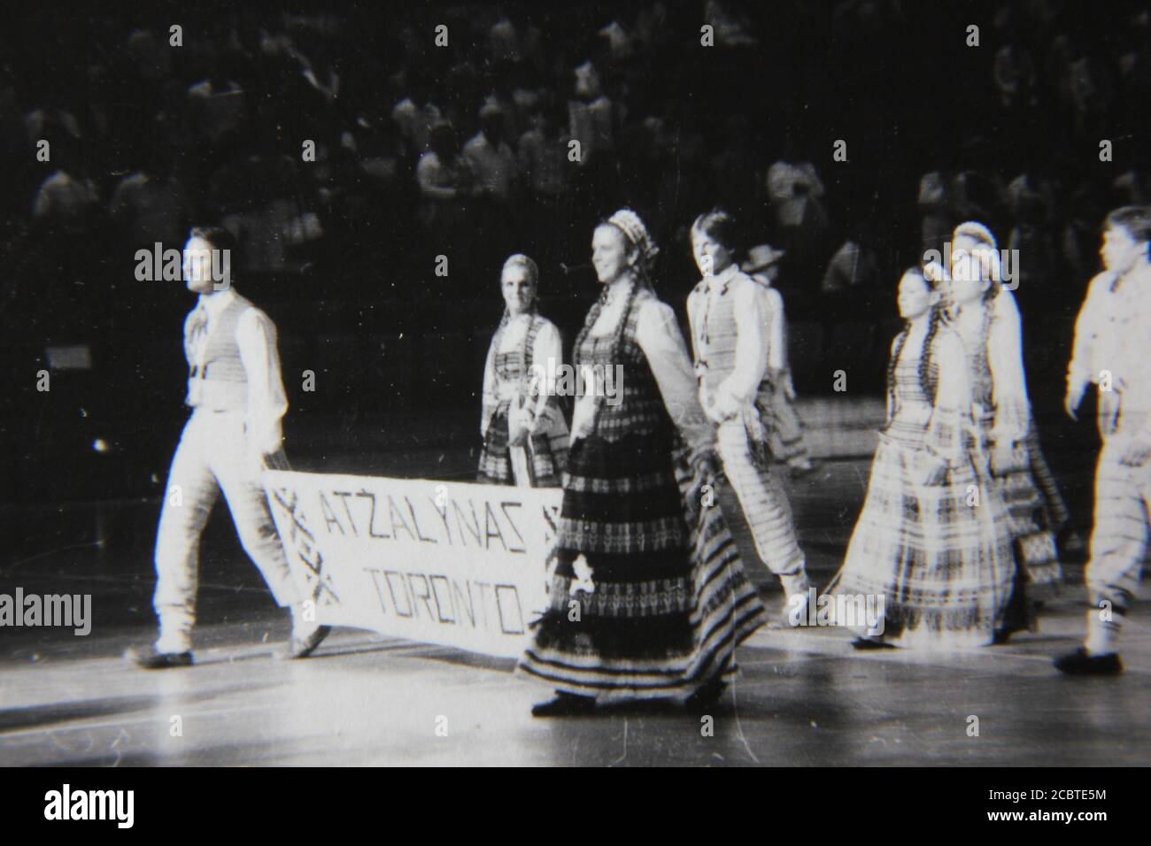 Fine 1970s vintage black and white photography of the Lithuanian folk dancing festival practice day at the UIC Pavilion in Chicago. Stock Photo