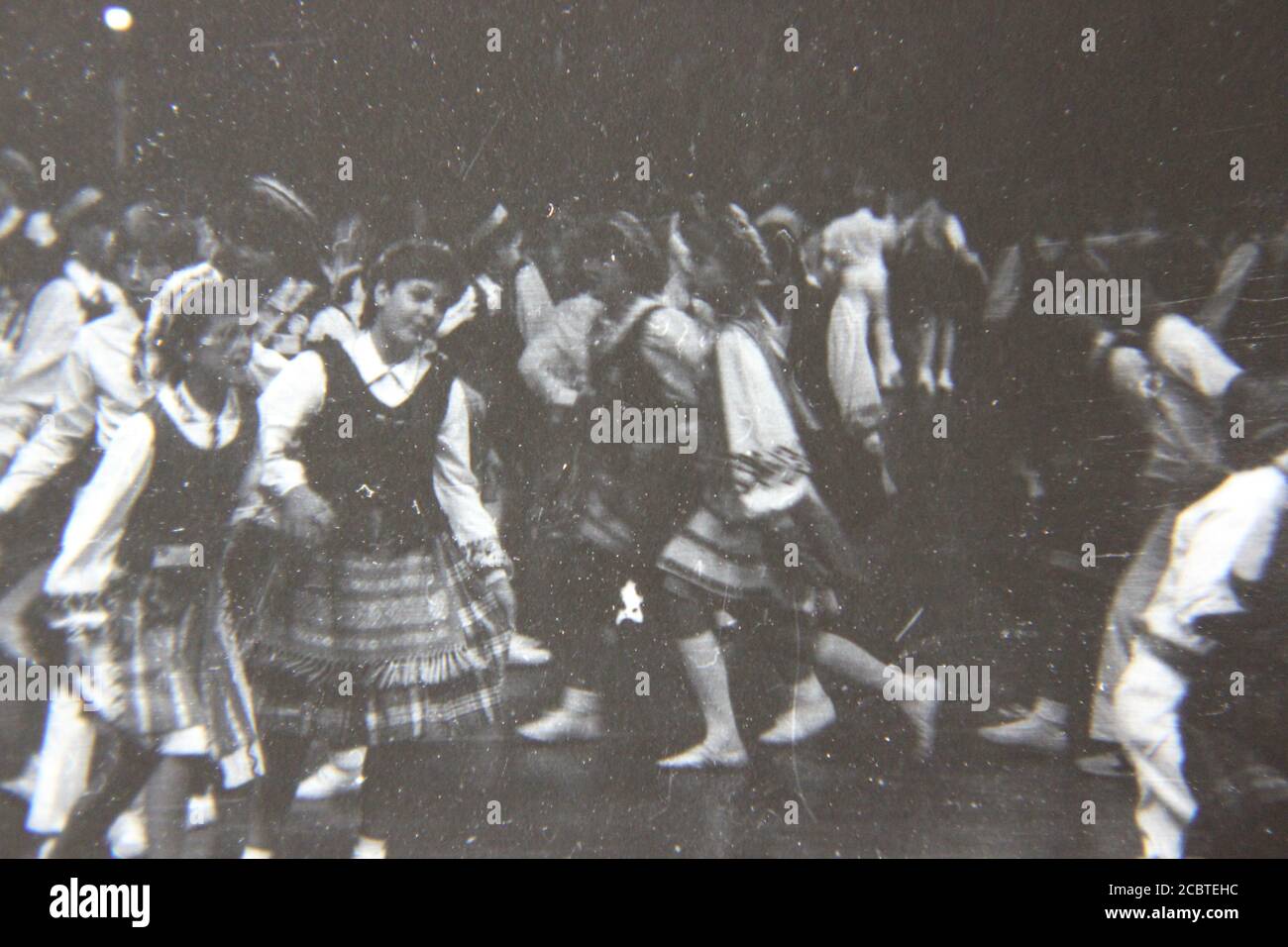 Fine 1970s vintage black and white photography of the Lithuanian folk dancing festival practice day at the UIC Pavilion in Chicago. Stock Photo