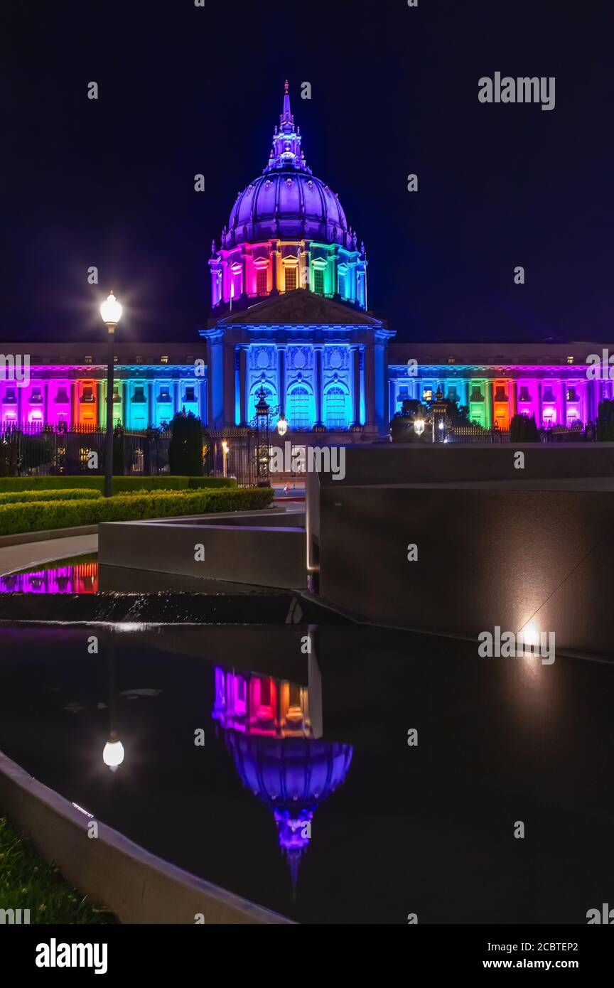 San Francisco City Hall lights up rainbow colors to celebrate the LGBT pride month in June, California, United States. Stock Photo