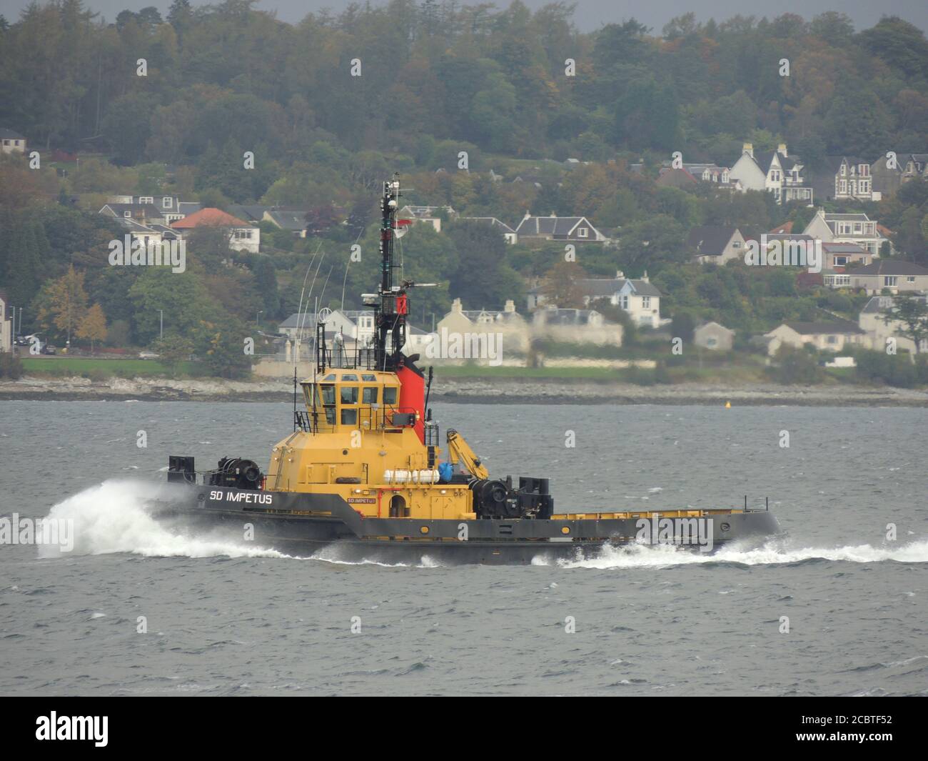 SD Impetus, a tugboat operated by Serco Marine Services, passing Gourock to escort the US Navy's