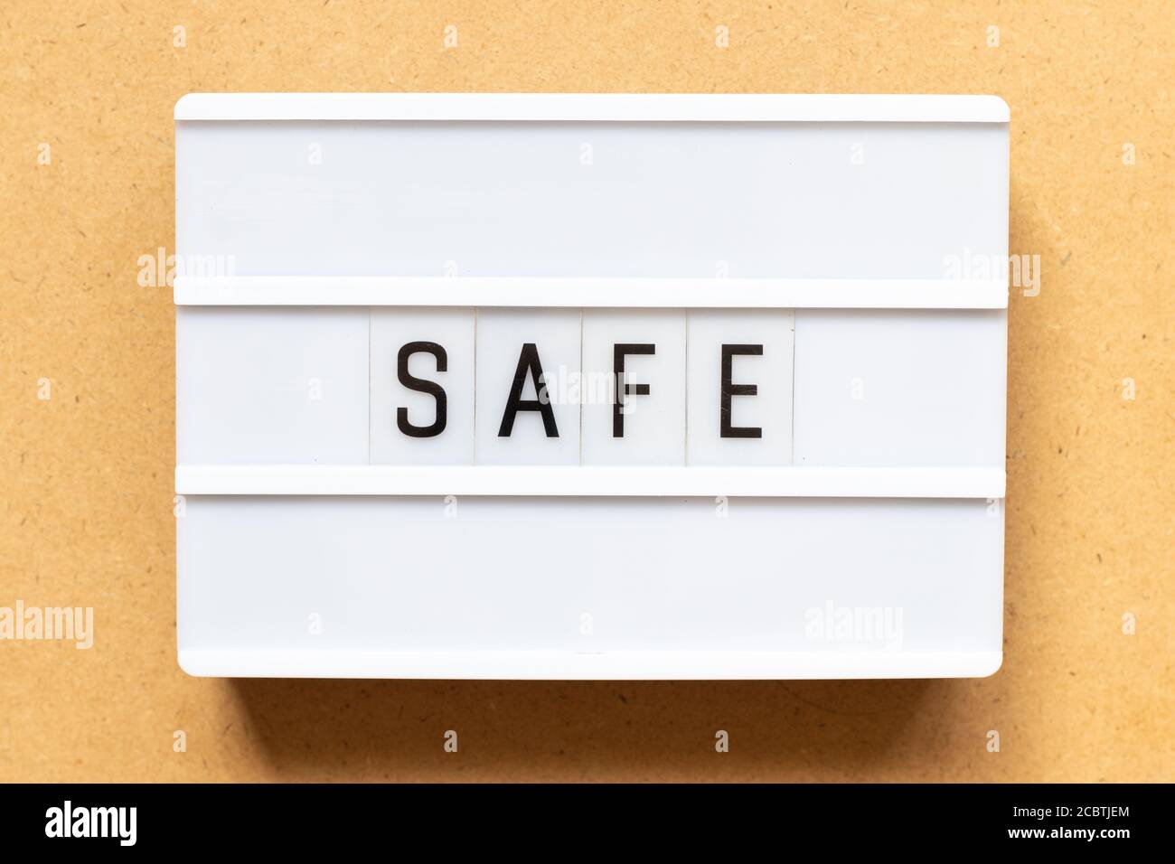 Lightbox with word safe on wood background Stock Photo