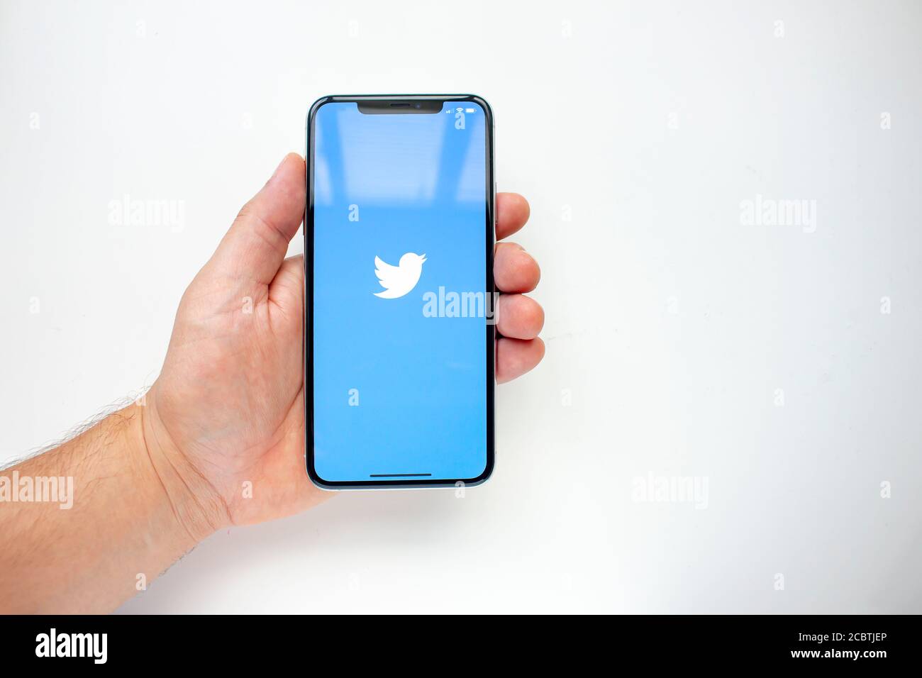 Calgary, Alberta, Canada. Aug 15, 2020. A person holding an iPhone 11 Pro Max with the Twitter App Stock Photo