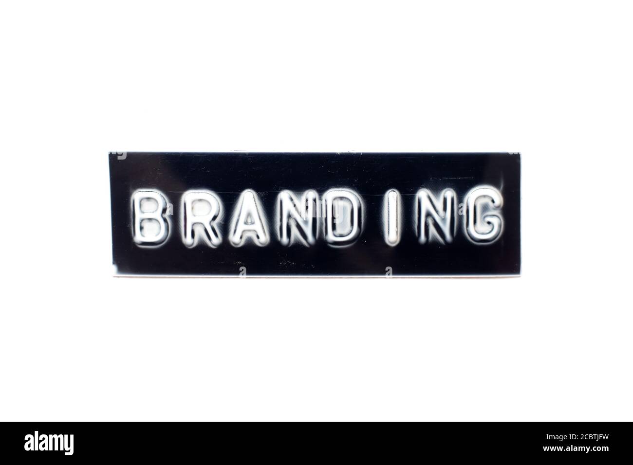 Embossed letter in word branding in black banner on white background
