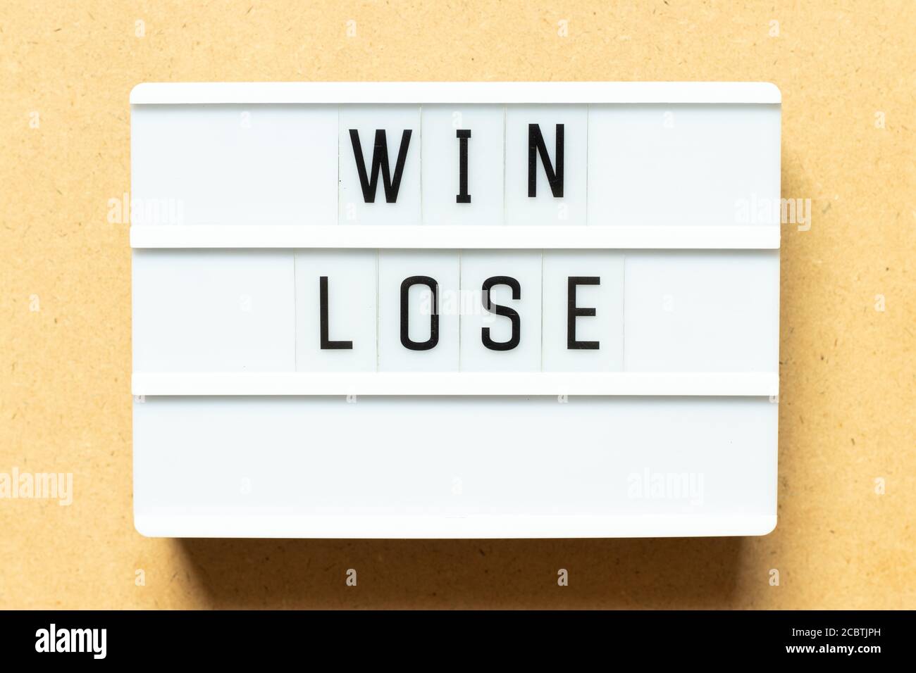 Lightbox with word win lose on wood background Stock Photo