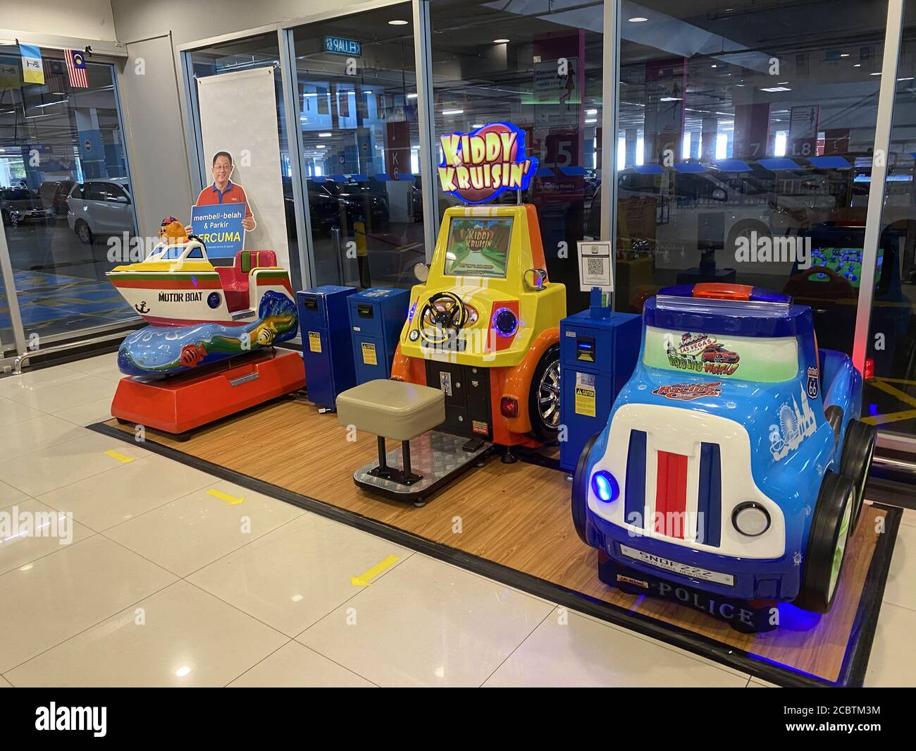 Penang, Malaysia - August 16, 2020 : View of three coin operated kiddie rides displayed at the entrance of a store at Tesco Egate Penang Stock Photo