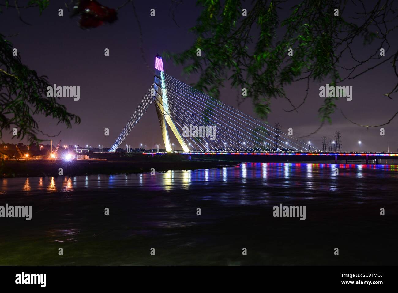 Delhi, India. 15th Aug, 2020. A view of the Signature Bridge during a colourful lighting show at Wazirabad. Credit: SOPA Images Limited/Alamy Live News Stock Photo