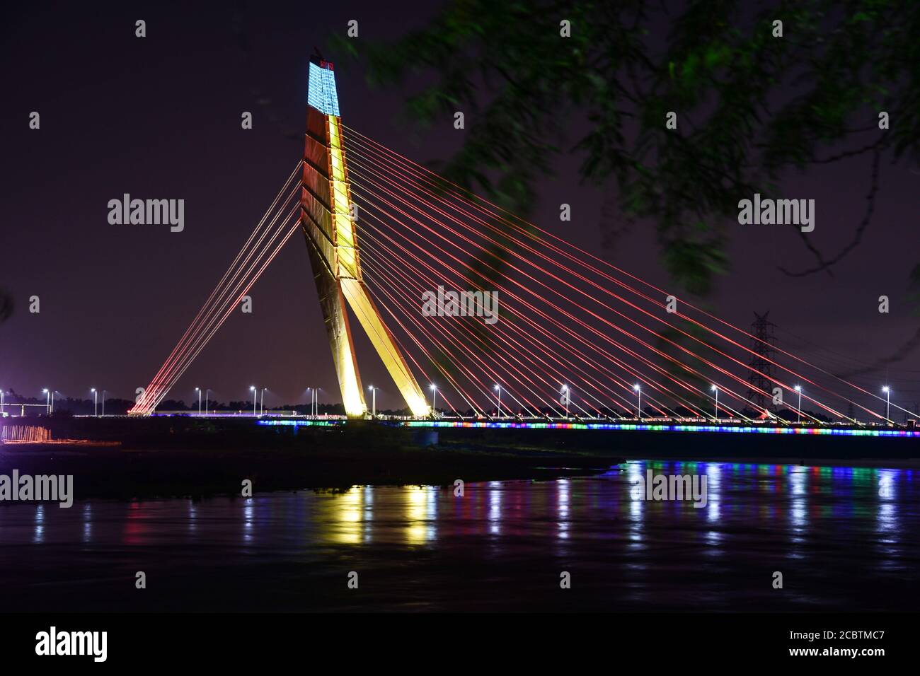 Delhi, India. 15th Aug, 2020. A view of the Signature Bridge during a colourful lighting show at Wazirabad. Credit: SOPA Images Limited/Alamy Live News Stock Photo