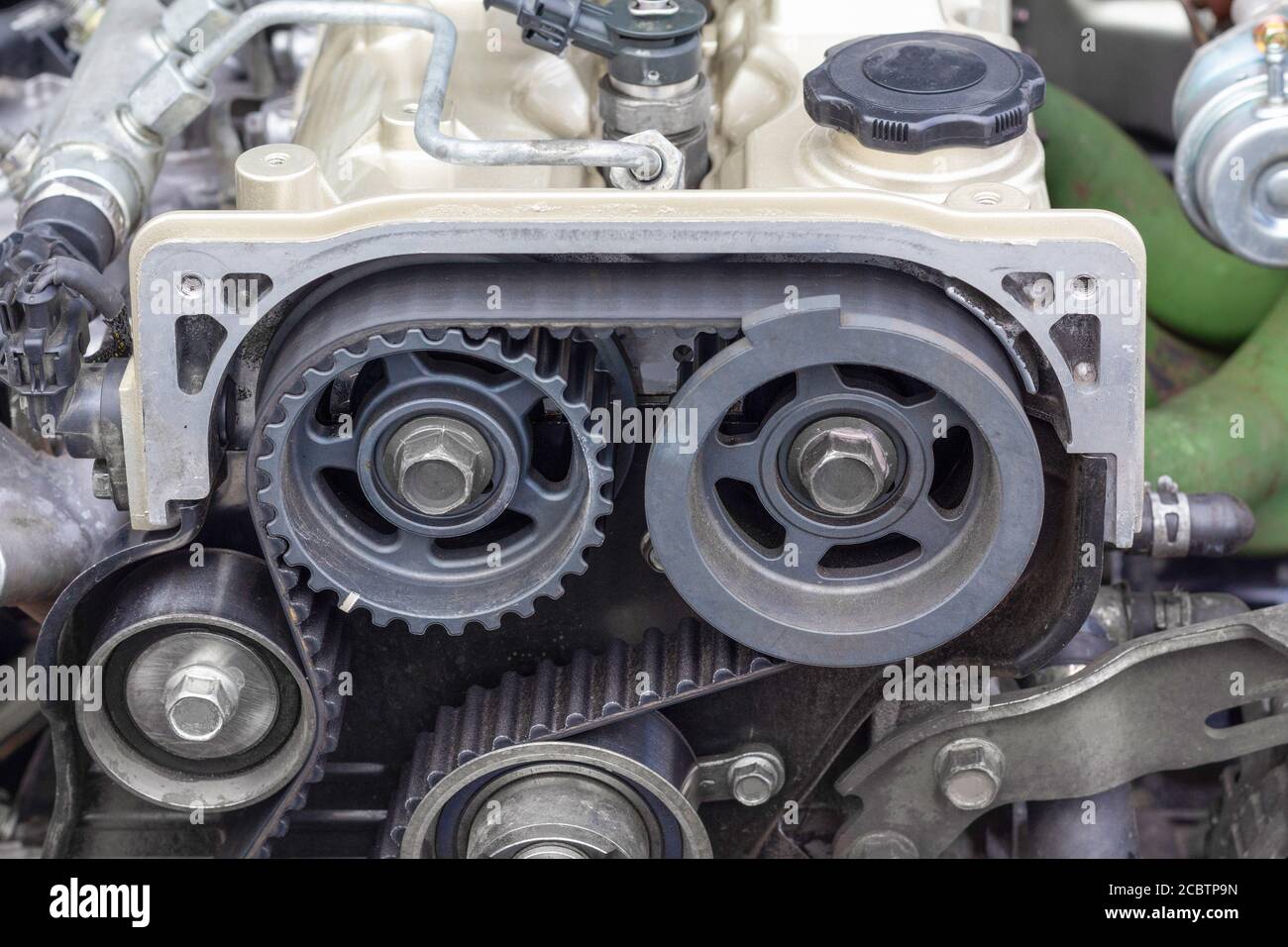 Timing belt and twin camshaft sprocket in engine racing car. Stock Photo