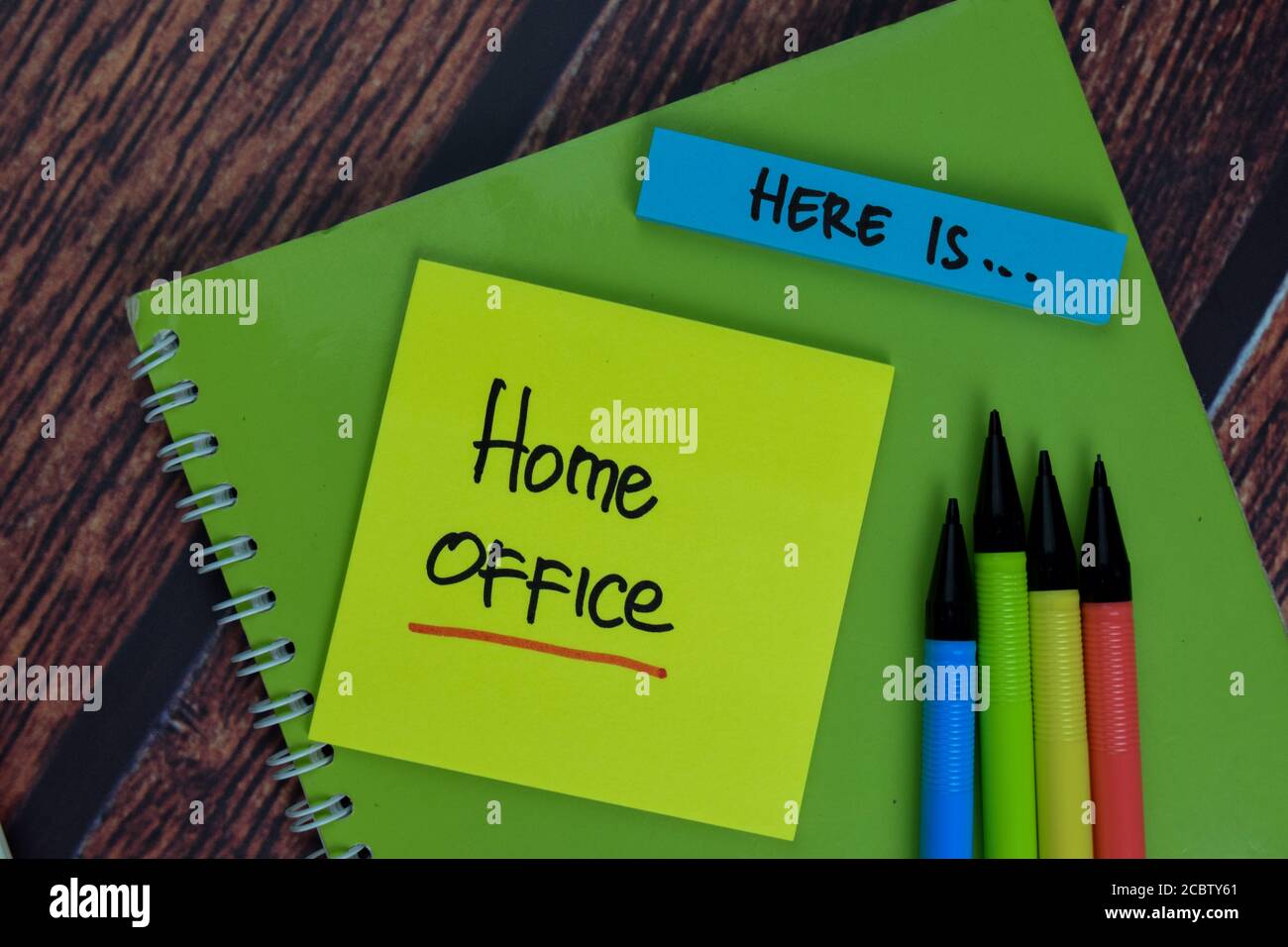 Here Is, Home Office text on sticky notes with office desk Stock Photo