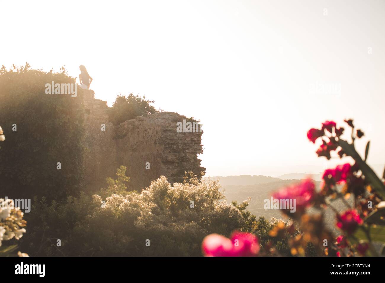 Girl sitting on high hill hi-res stock photography and images - Alamy