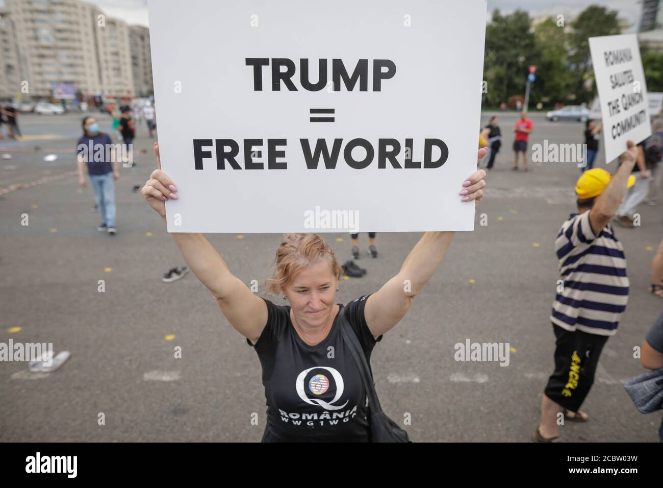 Bucharest, Romania - August 10, 2020: People display Qanon messages on cardboards during a political rally. Stock Photo