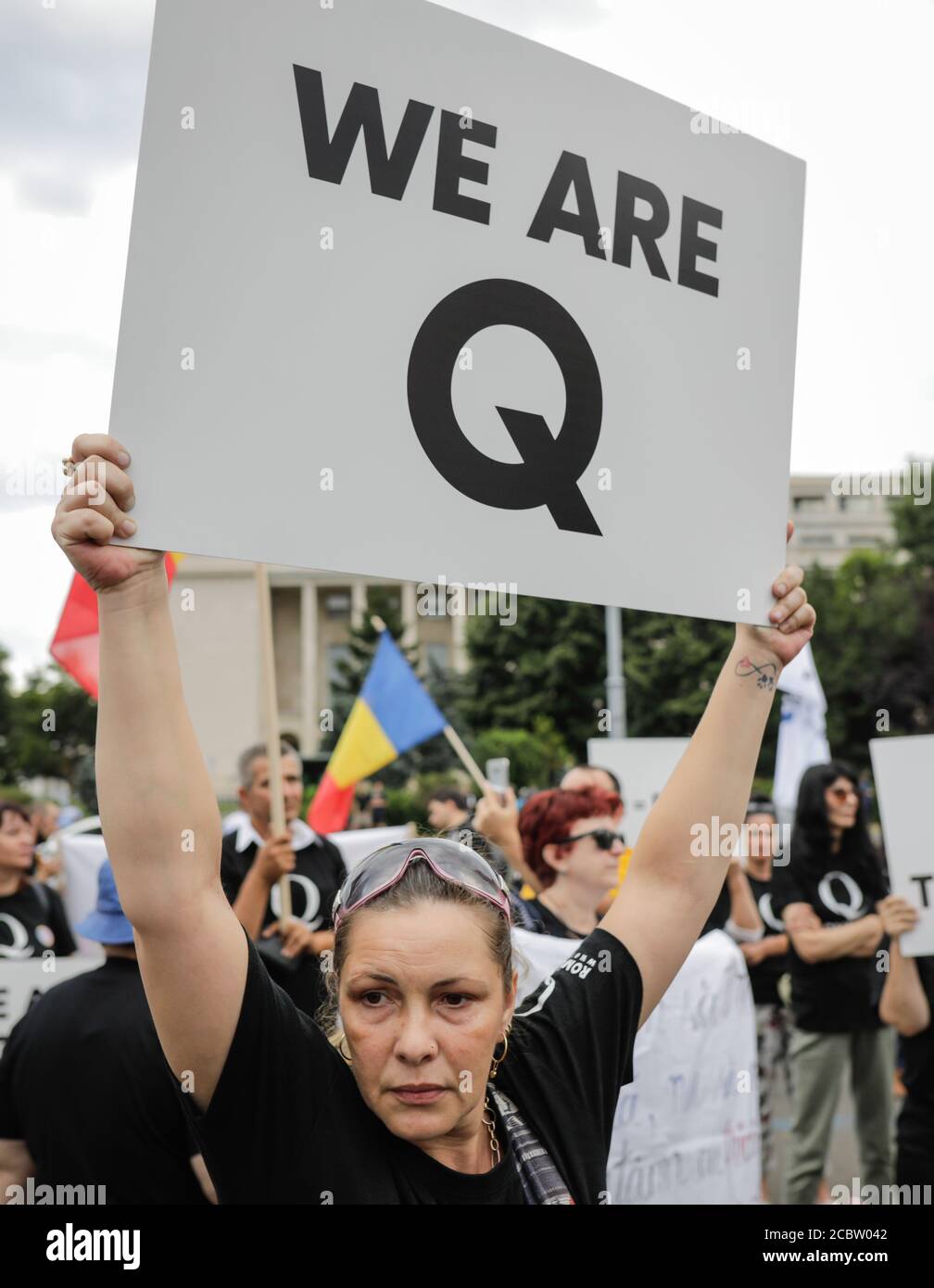 Bucharest, Romania - August 10, 2020: People display Qanon messages on cardboards during a political rally. Stock Photo