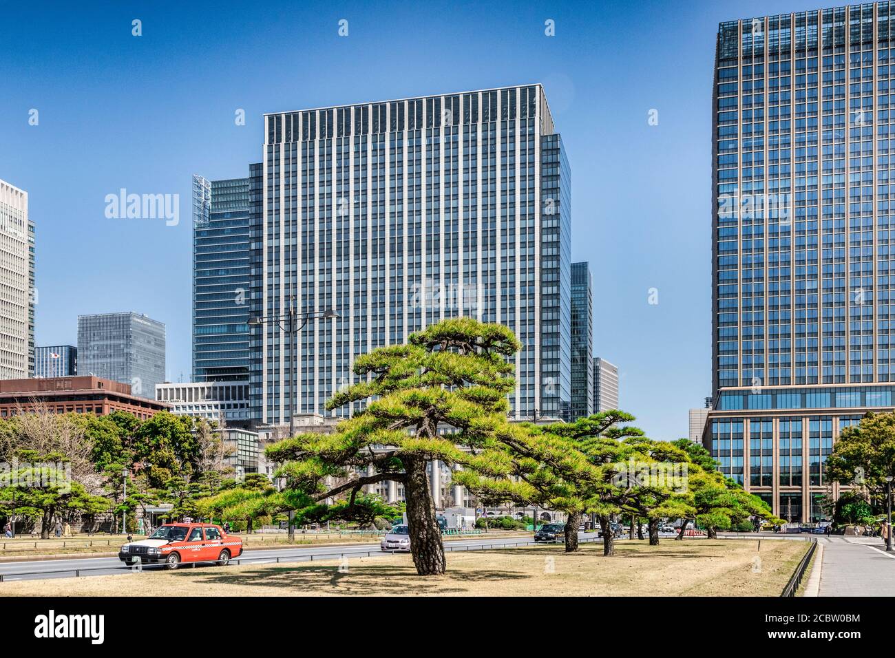 3 April 2019: Tokyo, Japan - High rise office buildings of Tokyo CBD, seen from the approach to Kokyo Gaien National Garden on Kajibashi Dori. Stock Photo
