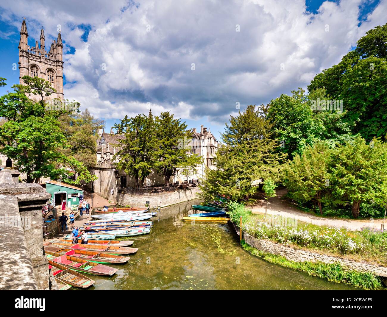 6 June 2019: Oxford, UK - Punts lined up ready for tourists on the River Cherwell, on a fine sunny summer day, tourists ready to get on board, Stock Photo