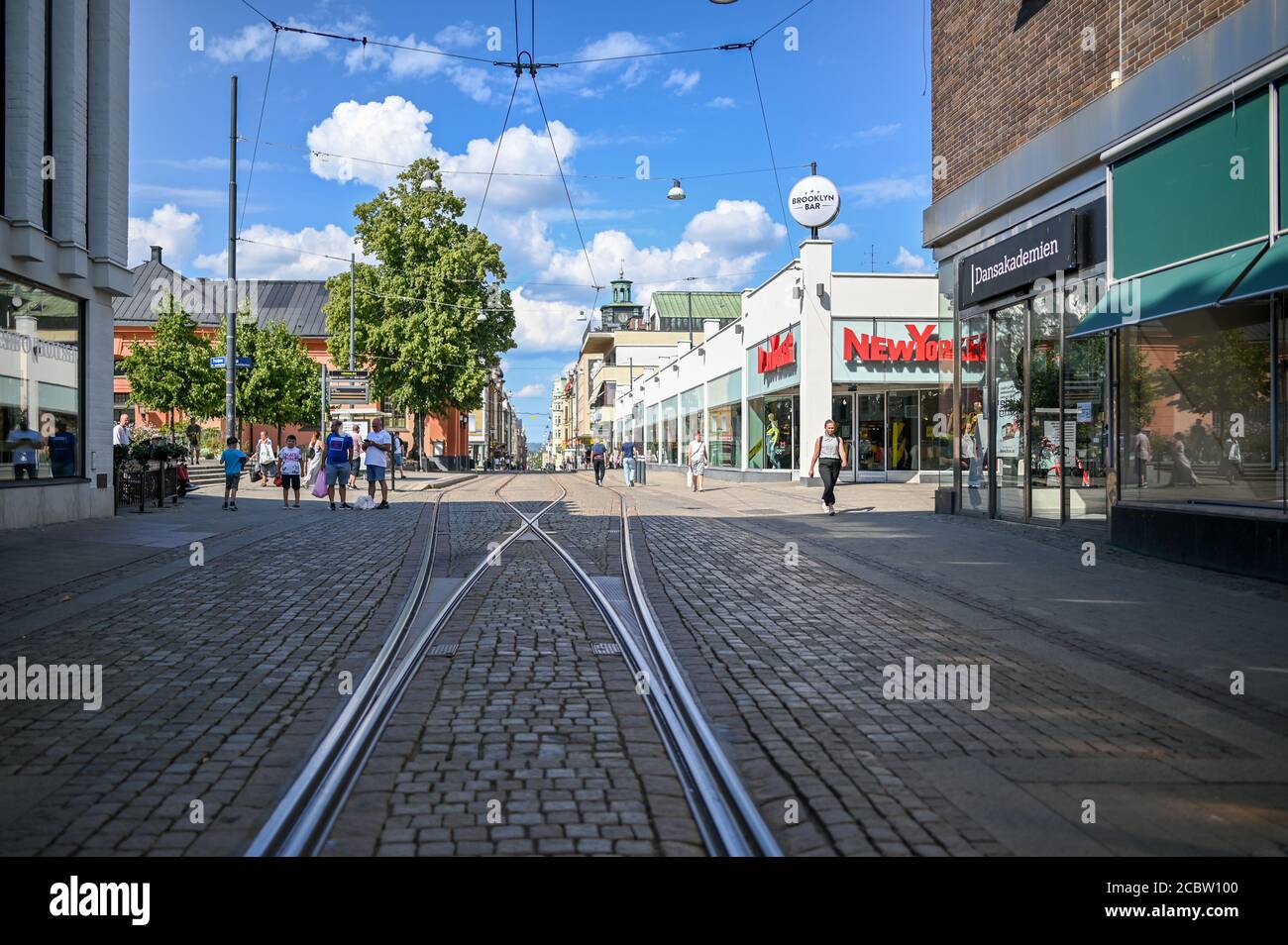 Tram tracks on Drottningatan in the city center of Norrkoping, Sweden. This is the main street in historic industrial town Norrkoping. Stock Photo