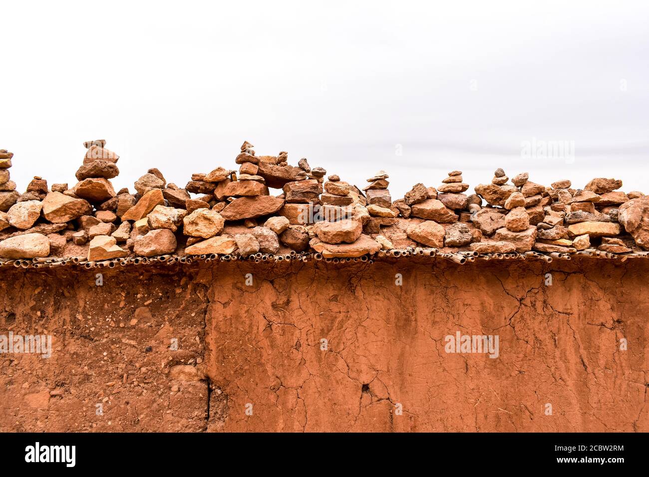 A wall with piled stones in Ait Benhaddou Stock Photo
