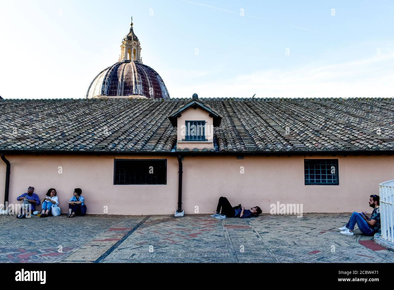 Visitors resting at the rooftop of St. Peter's Basilica Stock Photo