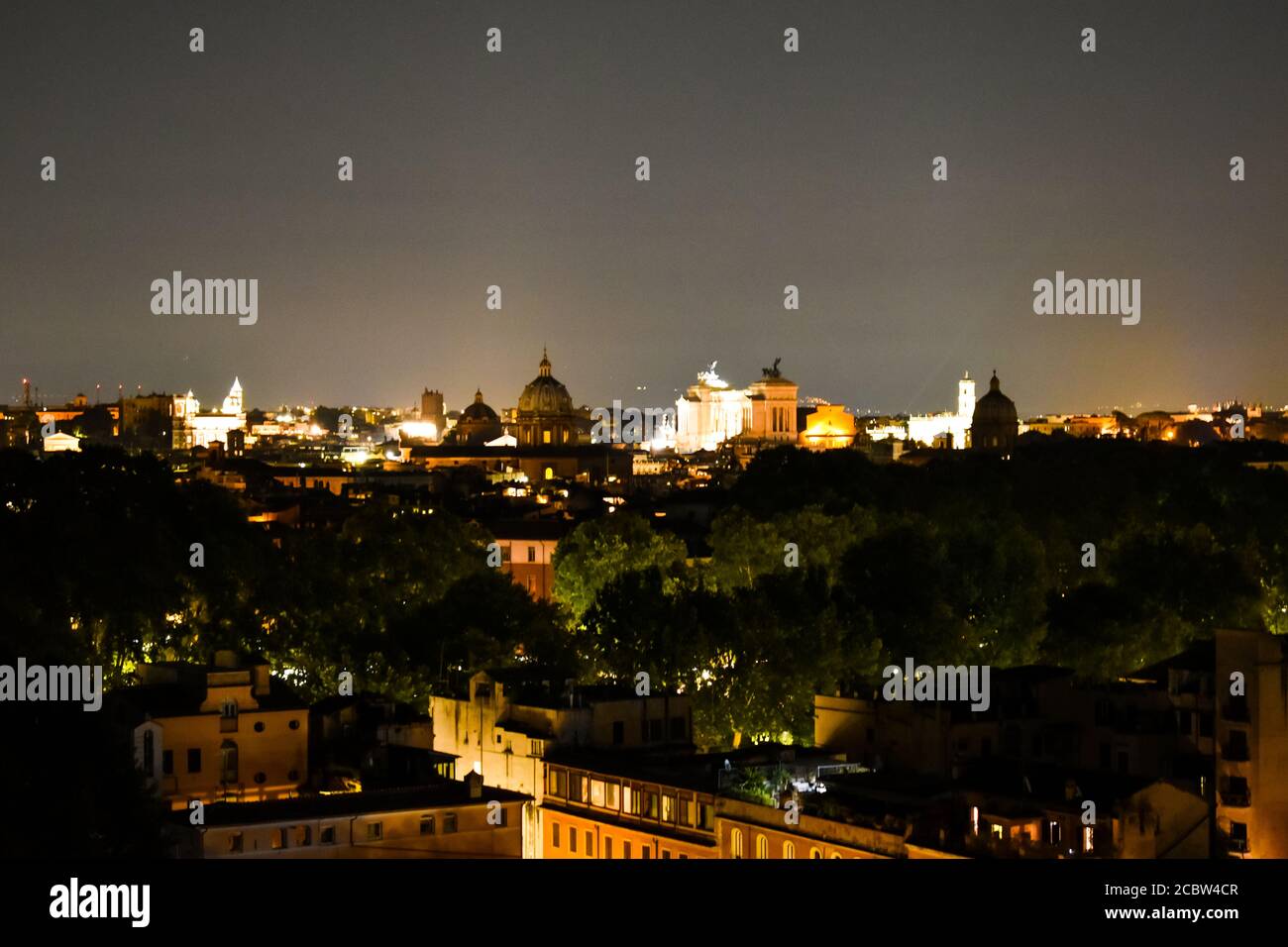 Rome at night with the dome of Saint Peter's Basilica and Piazza Venezia in the distance Stock Photo