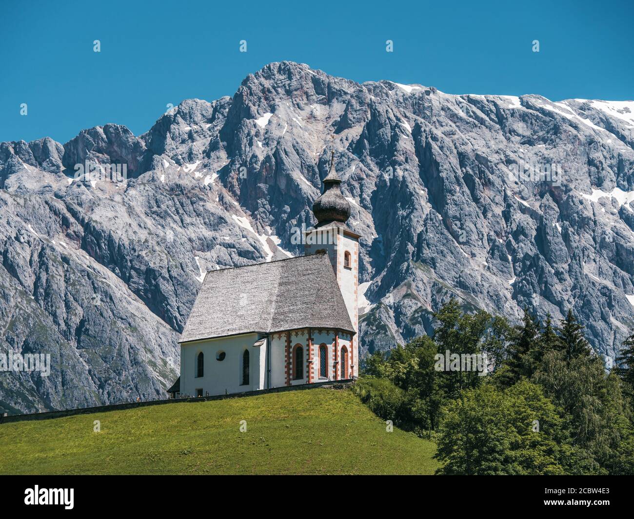 Scenic Parish church of Dienten with Hochkönig mountain on the background. Pinzgau, Salzburg, Austria. Stock Photo