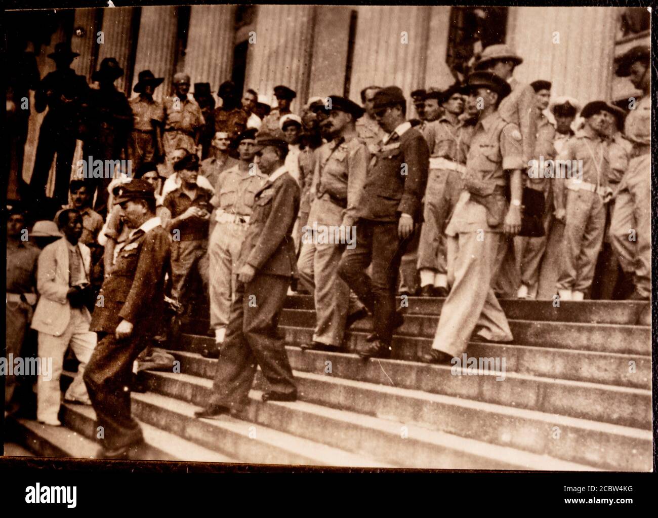 Japanese Surrender to Lord Louis Mountbatten in Singapore 12 September 1945 These original photographic prints were bought home from the far east by the photographers father in the bottom of a tool box after the war. They are in a family album and copied by this photographer SINGAPORE. 1945-09-12. ADMIRAL LORD LOUIS MOUNTBATTEN SUPREME ALLIED COMMANDER, SOUTH EAST ASIA COMMAND (SEAC), ACCEPTED THE SURRENDER OF JAPANESE FORCES IN THE AREA DURING A SURRENDER CEREMONY HELD IN THE COUNCIL CHAMBER, MUNICIPAL BUILDING, SINGAPORE. IN THE ABSENCE OF FIELD MARSHAL COUNT TERAUCHI, JAPANESE COMMANDER IN Stock Photo