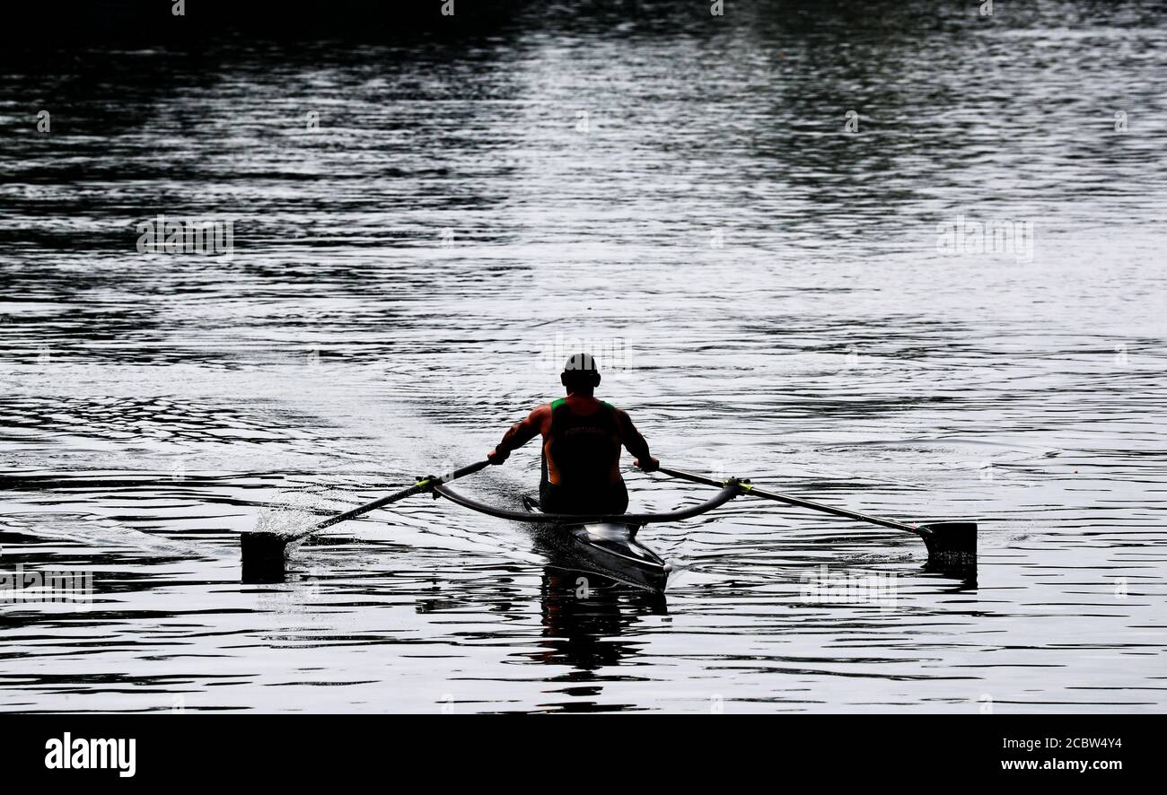 A Rower travels along the river Thames near Bray, Berkshire. Stock Photo