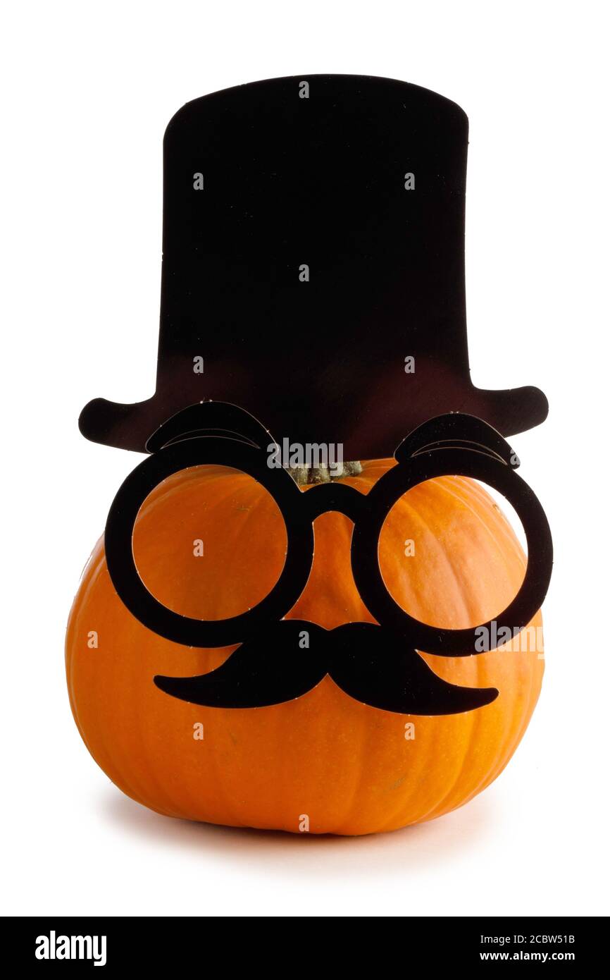 Jack O Lantern Halloween pumpkin in cylinder hat Mustache and glasses isolated on white background Stock Photo