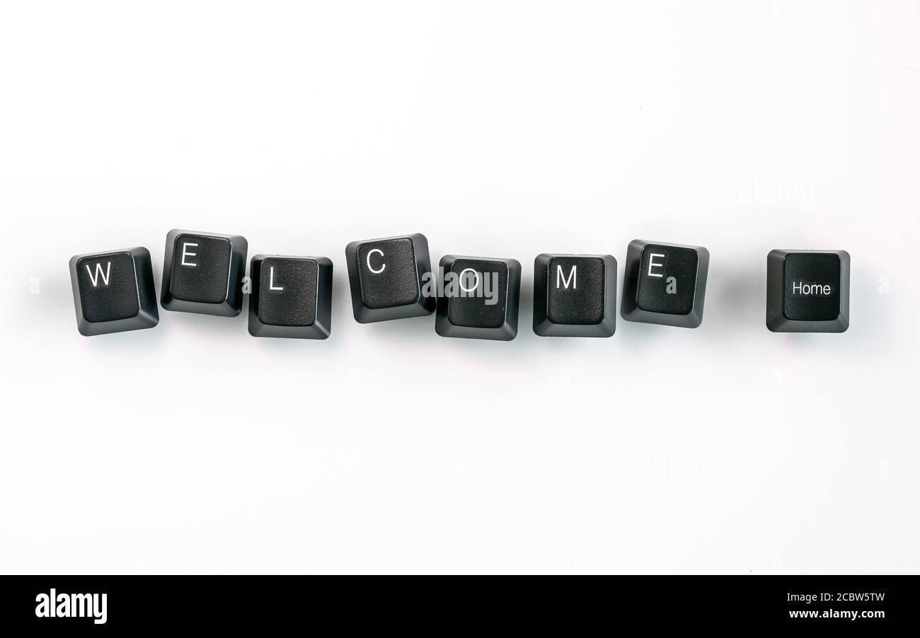 Computer keyboard keys spelling Welcome Home, isolated on white background Stock Photo