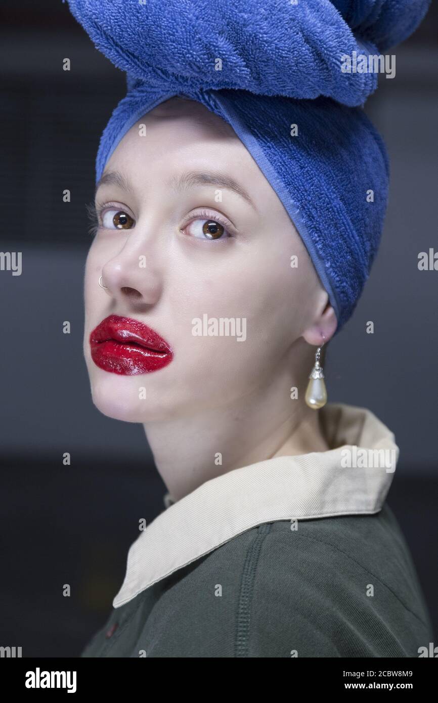 Girl with pearl and blue turban Stock Photo