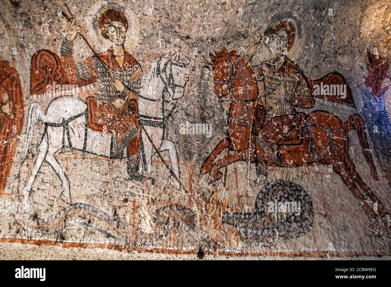 A fresco depicting St George and St Theodore mounted on horses in Yilanli (Snake) Church at the Open Air Museum near Goreme in Turkey. Stock Photo