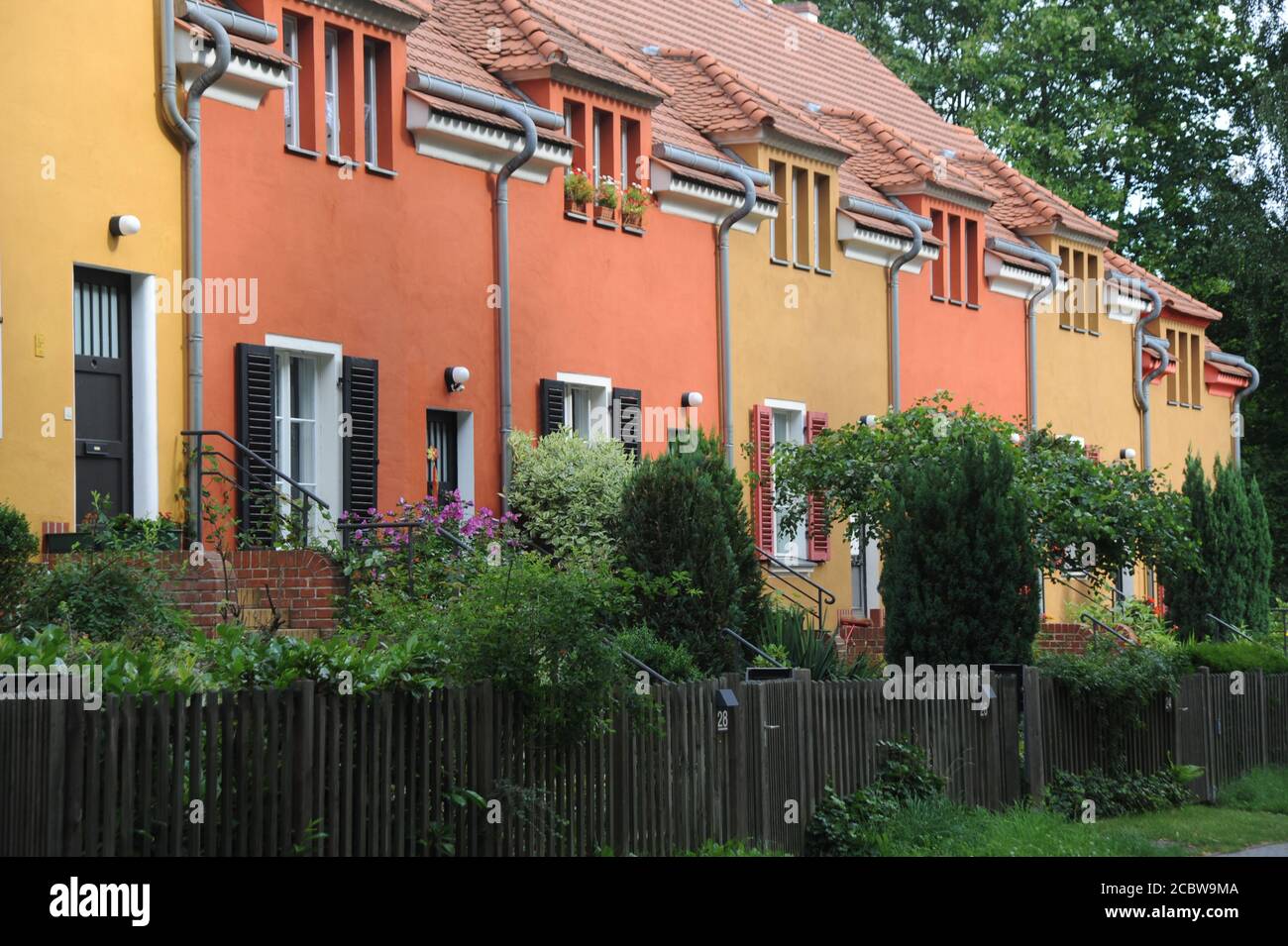 Germany, Berlin. The artfully painted houses of Garden City Falkenberg from 1912 became a UNESCO world heritage site in 2008 Stock Photo