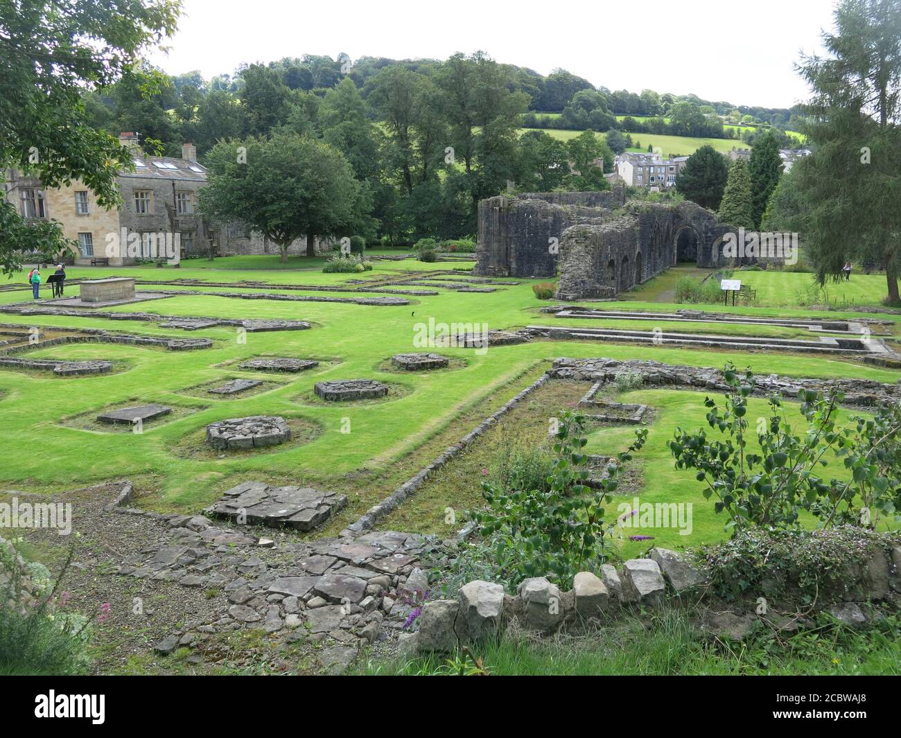 View of the grounds with the foundations and footprint of the former 14th century monastery at Whalley Abbey, Lancashire. Stock Photo