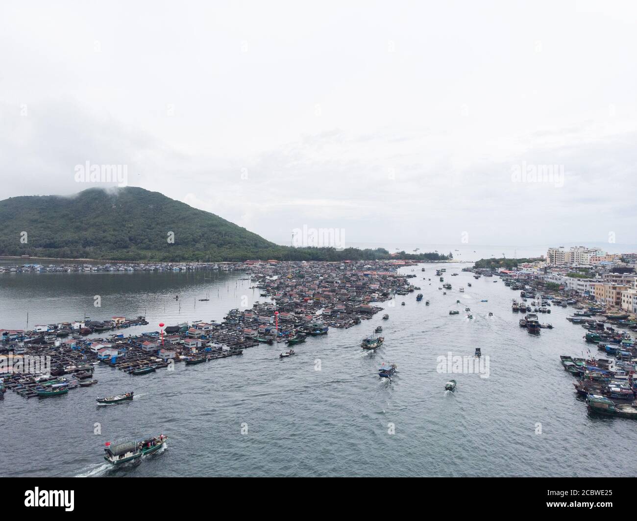 Lingshui. 16th Aug, 2020. Aerial photo taken on Aug. 16, 2020 shows fishing boats sailing on the sea as the summer fishing moratorium ended in Xincun Township in south China's Hainan Province. Credit: Zhang Liyun/Xinhua/Alamy Live News Stock Photo