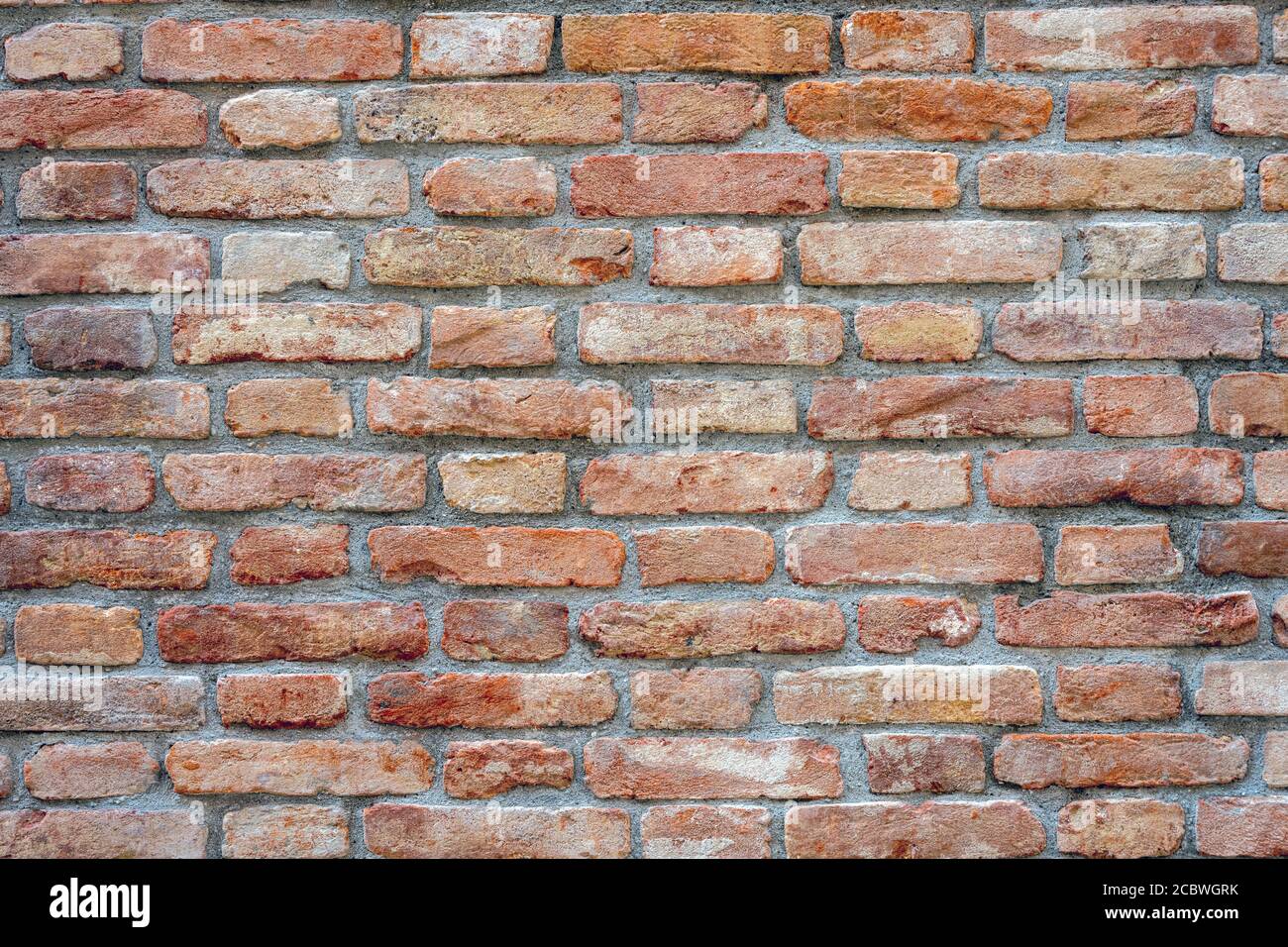 Background from an old and worn red brick wall Stock Photo