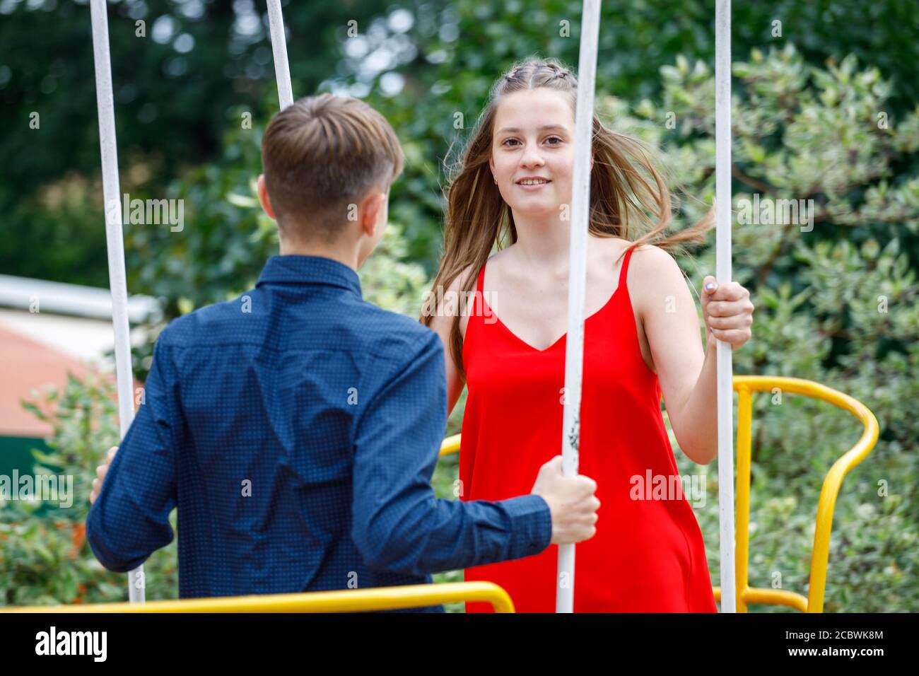 young couple having fun in the amusement park Stock Photo - Alamy