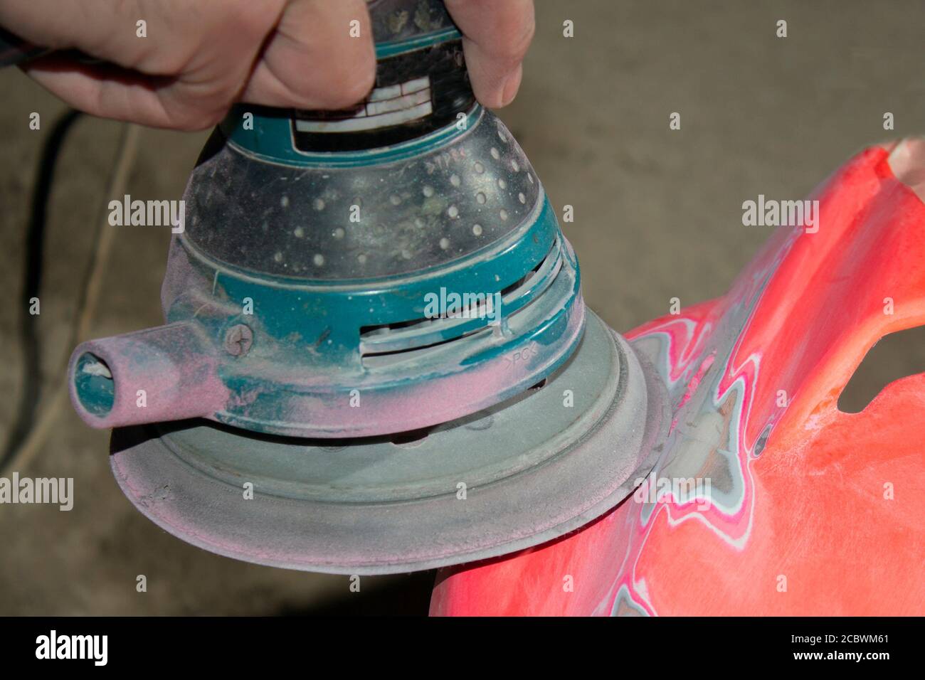 Work polishes the car body component, preparation before painting Stock