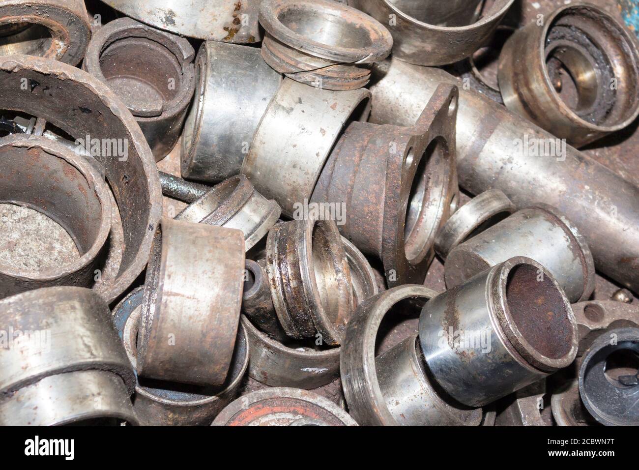 Useless, worn out rusty auto parts and other parts Stock Photo