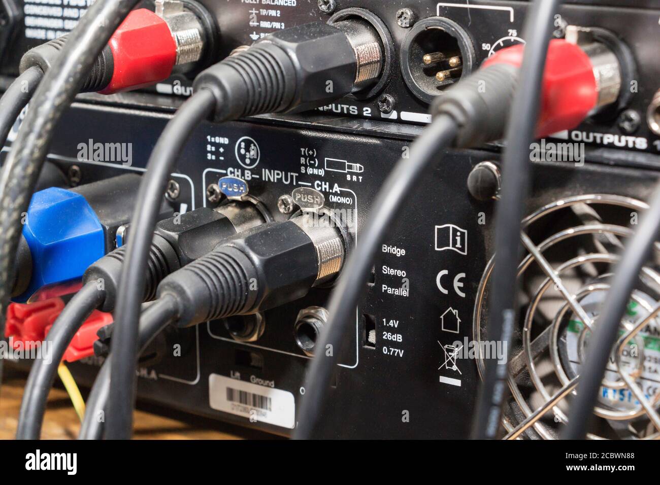 audio jack and wires connected to audio mixer, music dj equipment at concert, festival, bar. Stock Photo