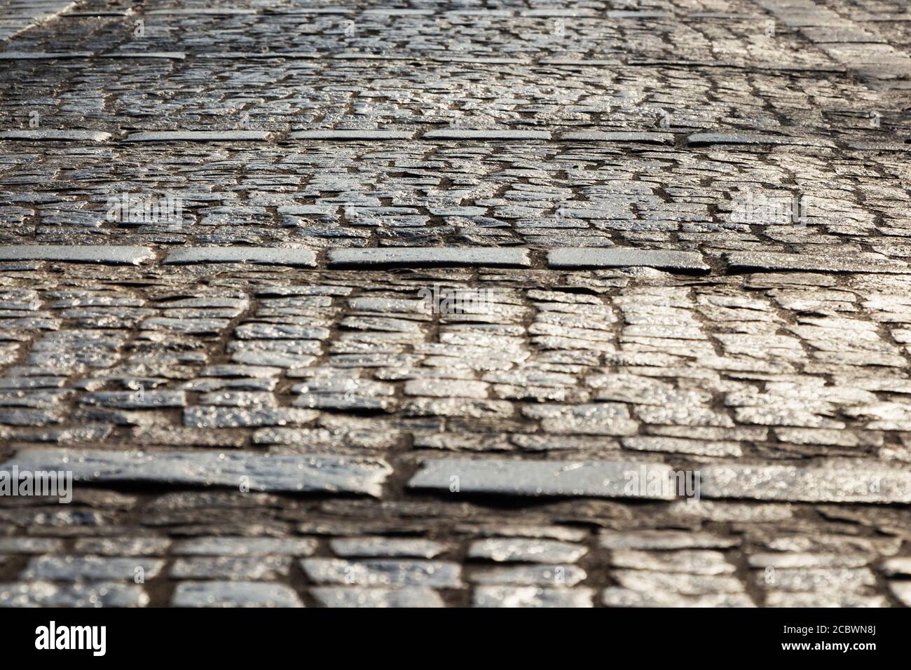 Abstract background of old cobblestone pavement close-up Stock Photo ...