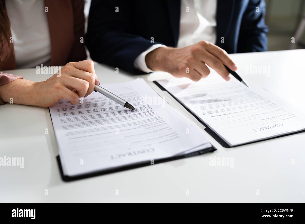 Lawyer People Review Document Before Signing In Office Stock Photo