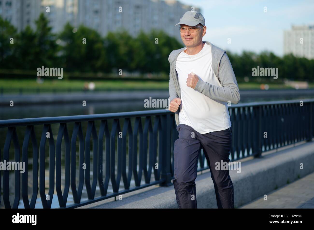 Mature Caucasian man jogging in the city Stock Photo