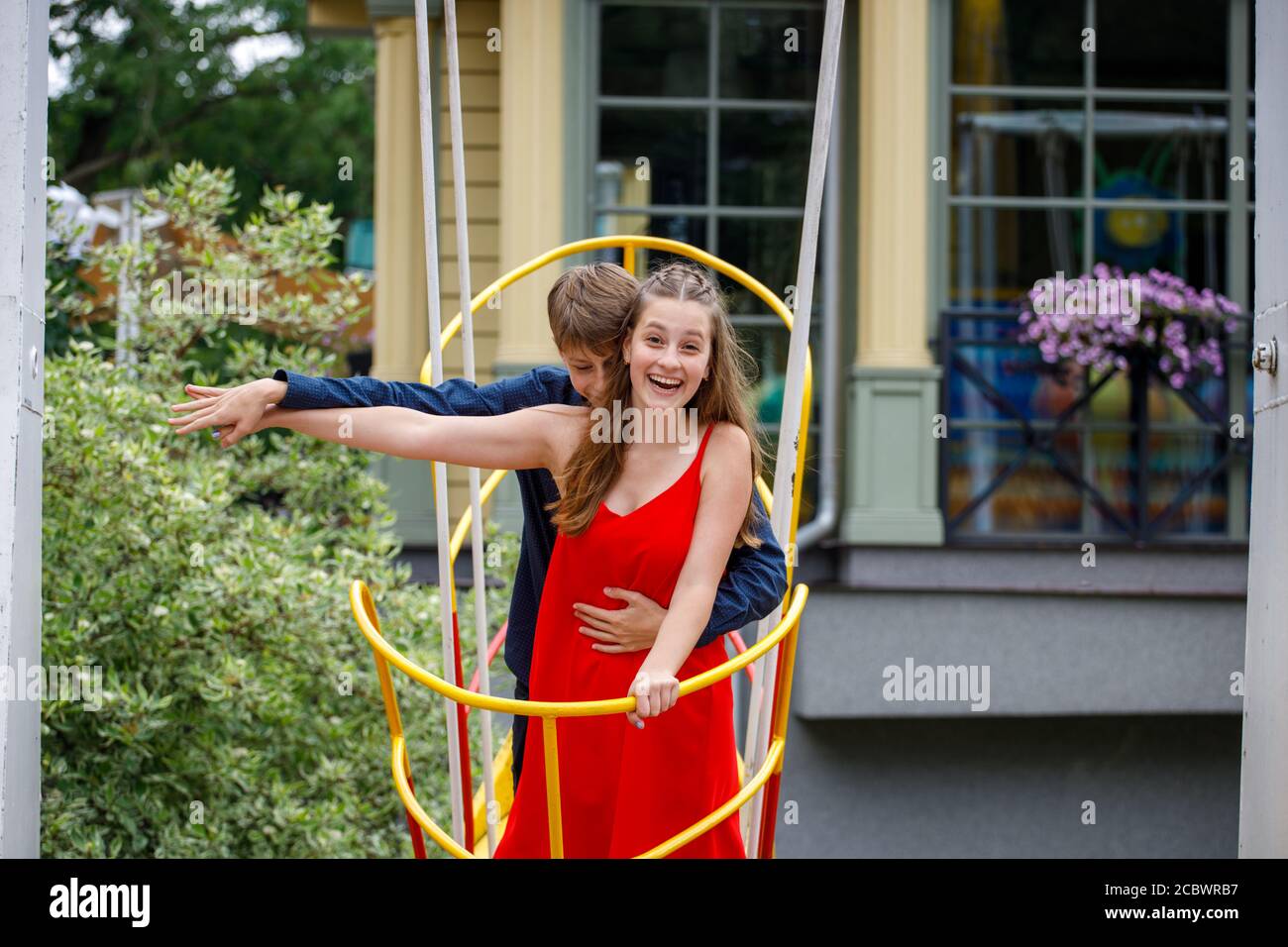 young couple having fun in the amusement park Stock Photo - Alamy