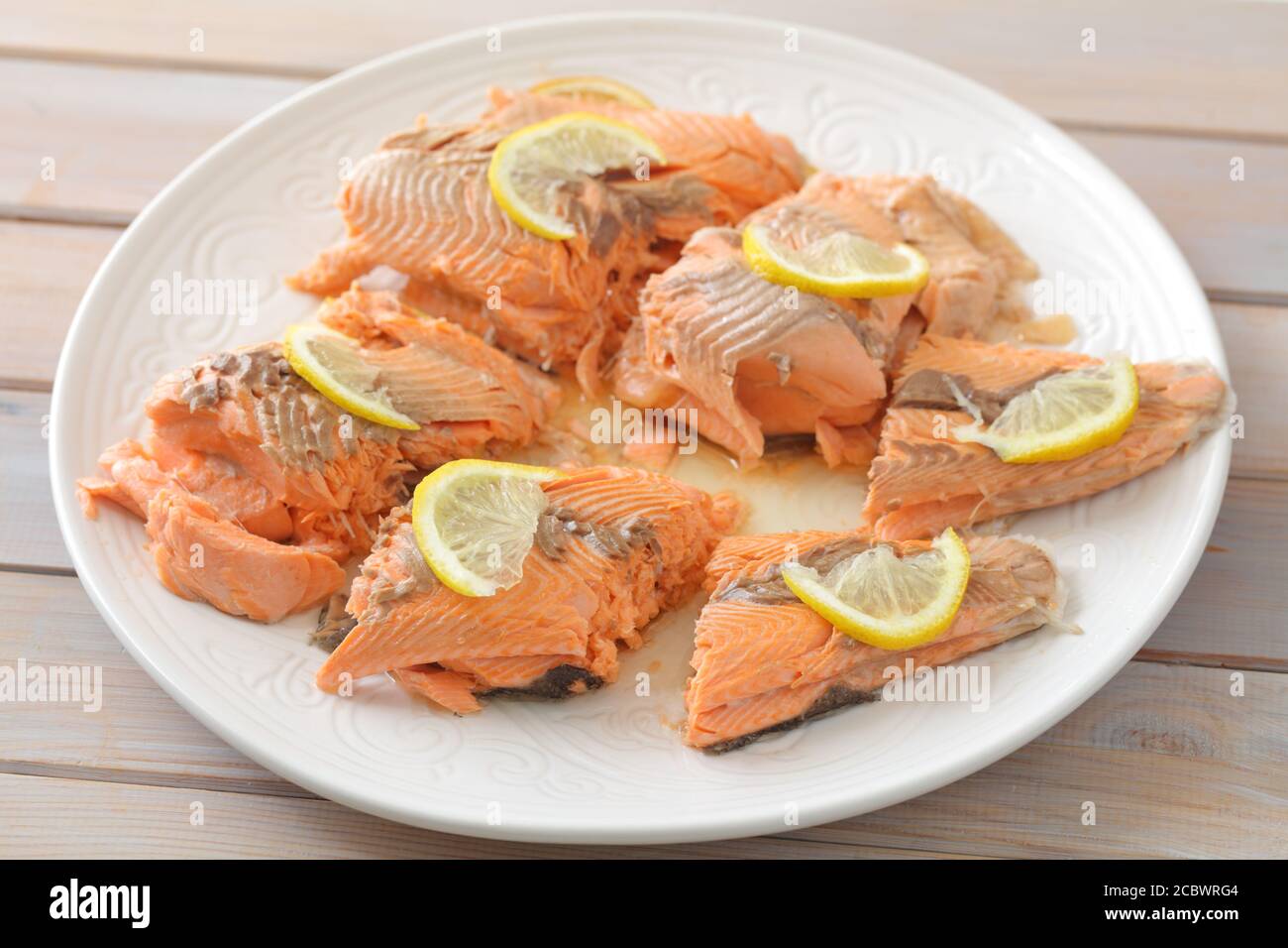 Baked trout fish served with slices of lemon Stock Photo